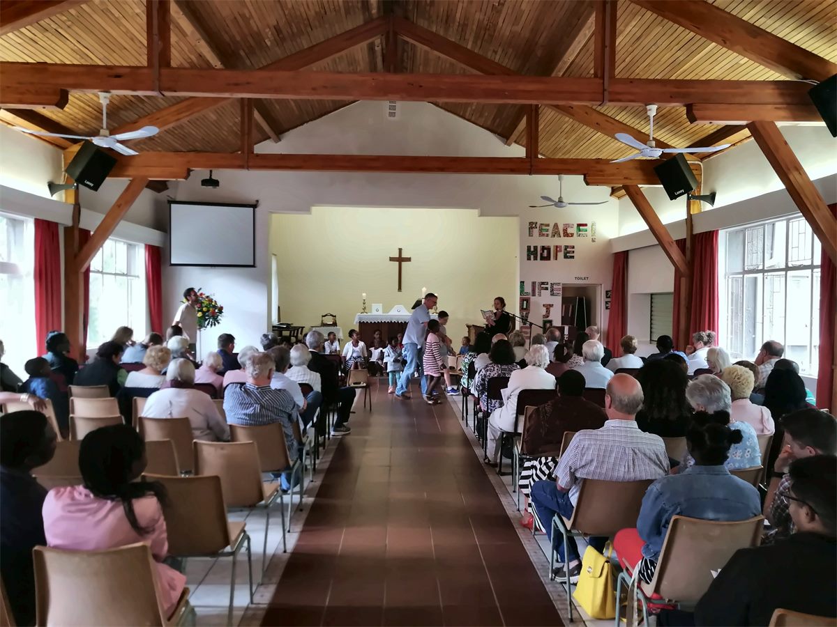 The parish hall filled with the congregation during a service