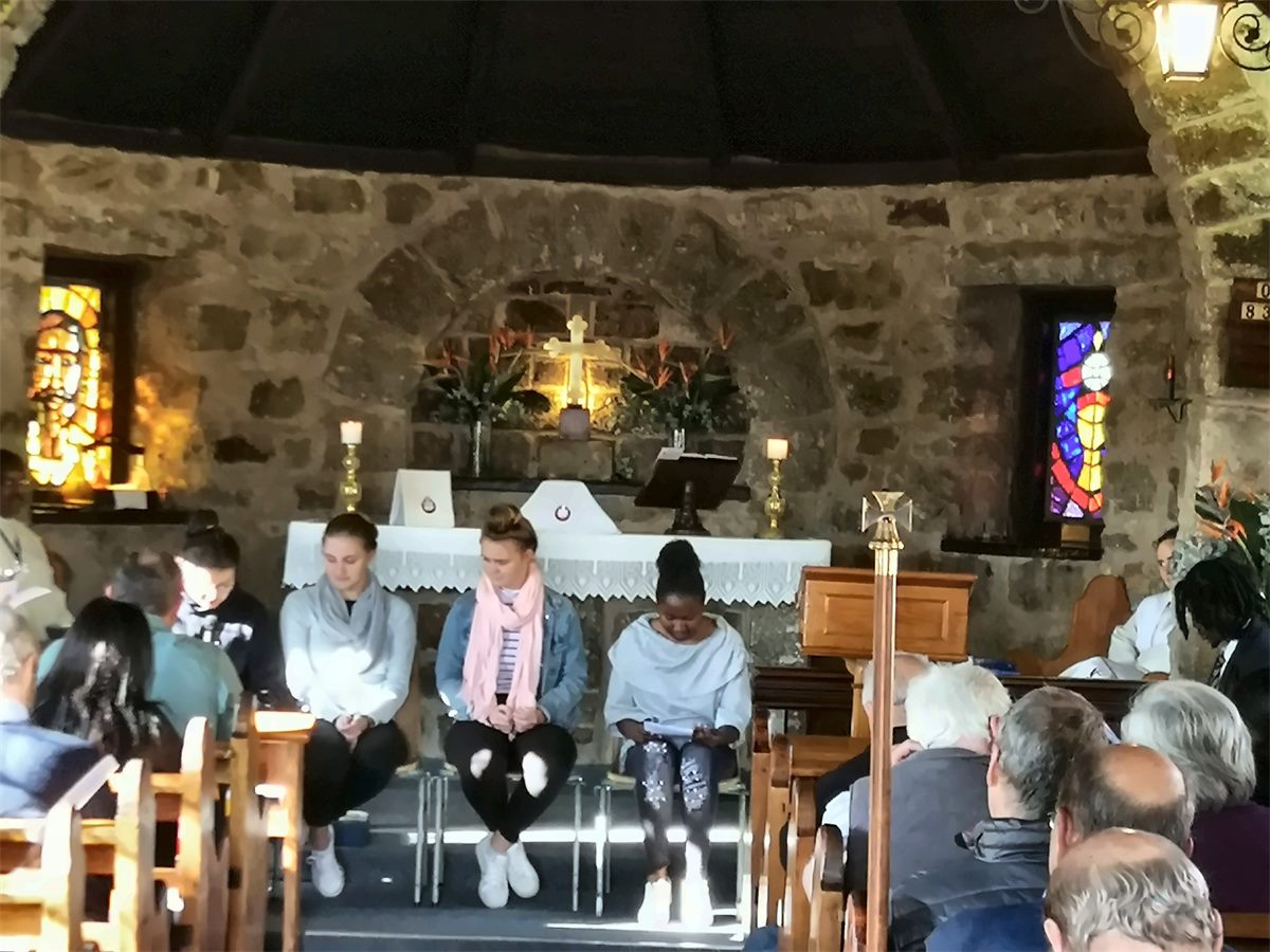 Confirmation candidates seated at the altar during a service