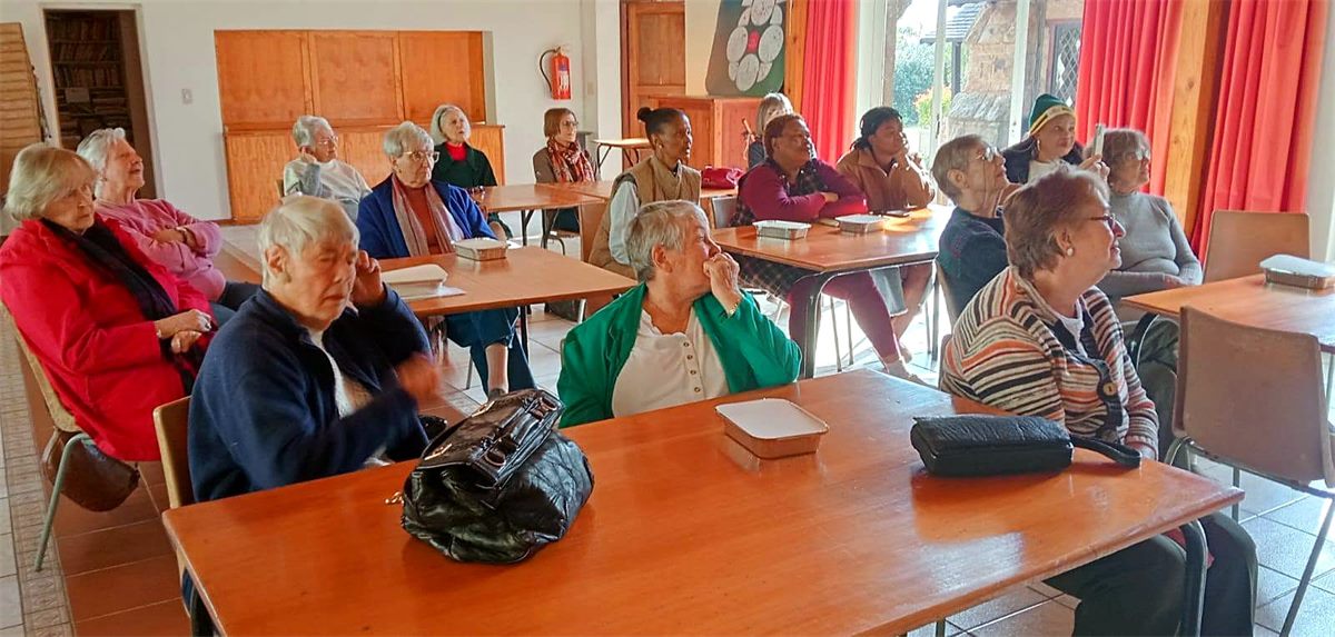 Members of the Ladies Fellowship gathered around a table at St George's