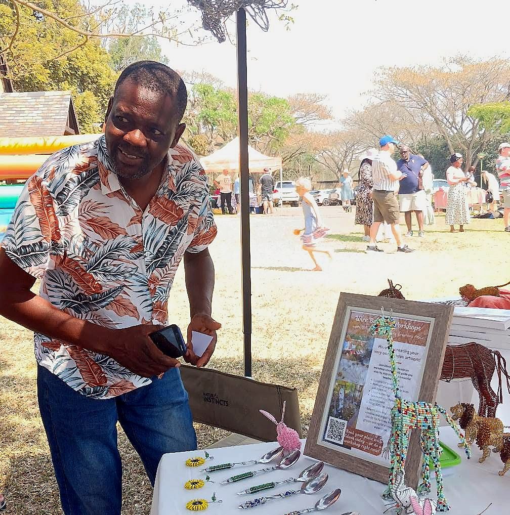 A beadwork artist at her stall at St George's Annual Craft Market